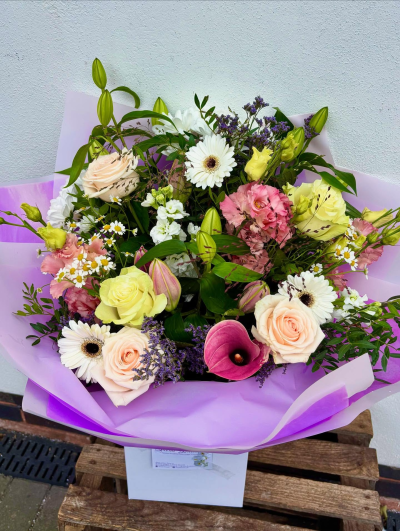 Pastel Garden Bouquet - A soft and romantic arrangement showcasing pastel tones of blush, cream, and lilac. Perfect for adding a touch of elegance to any setting.