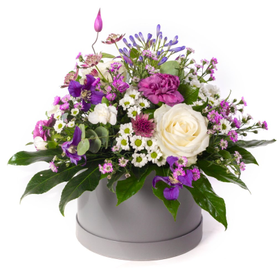 Purple Haze  - A jewel-toned beauty with a modern twist. Purple Haze combines soft whites with rich shades of purple and lilac, creating a striking contrast that feels both elegant and uplifting. Presented in a stylish hatbox, it’s a chic design full of colour, texture, and charm.