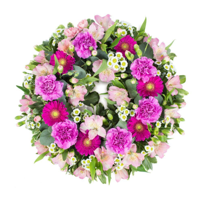 Wreath SYM-320 - A classic wreath in shades of pink finished with fine foliage.